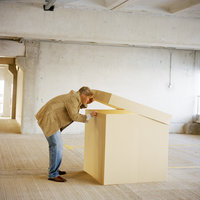 Image of man looking into box