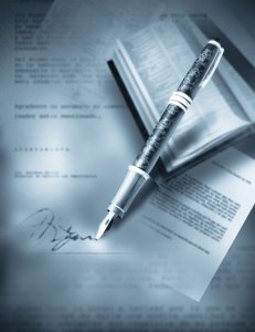 Image of a signed contract and pen