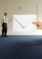 Man with oversized envelope